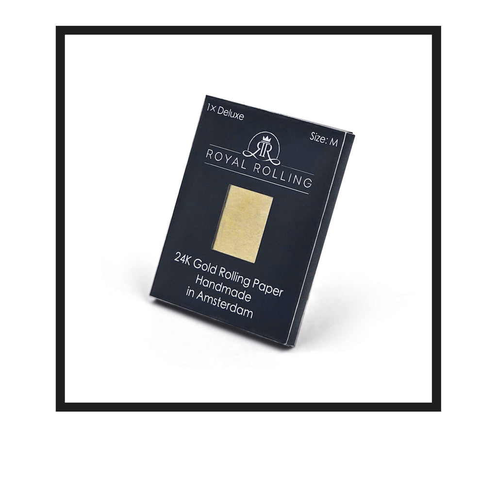 Royal Rolling Cone M made of 24-karat gold in a black-and-white Packaging, glass tube with twist cap. Handmade in Holland (Amsterdam, Alkmaar, Rotterdam, North Holland). Luxury gift with custom packaging. Available in Pure Gold Deluxe Size M, 70mm, Rolling paper in packaging
